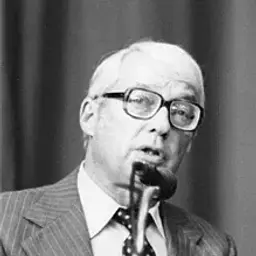 Harold Searles speaking at a microphone